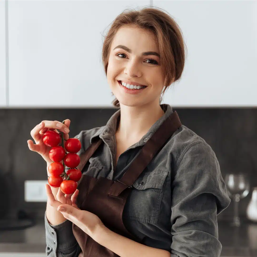 Chef Clara Dellucci in her kitchen preparing easy homemade recipes with passion.